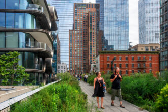 People walk along the High Line, an old rail line that was converted to an elevated park and greenway in Manhattan. Credit: Sergi Reboredo/VW Pics/Universal Images Group via Getty Images